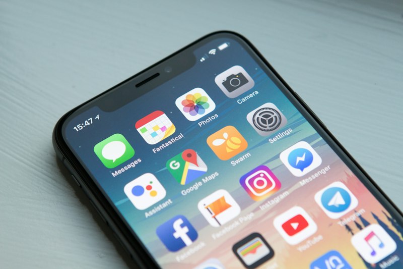 Smartphone showing a home screen full of apps