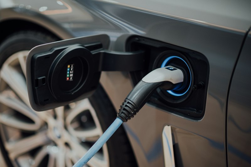 Electric car plugged into a charging point